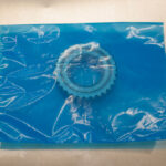 Small metal gear secured inside a ZERUST Flat VCI Bag.