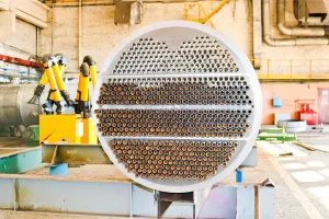 Heat exchanger being cleaned with AxxaClean rust remover