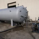 Pressure vessel undergoing hydrostatic testing with water treatment concentrate