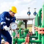 Field technician monitoring hydrostatic test conditions.