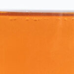 Amber-colored ZERUST Axxanol 758-NV in a close-up view.