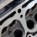 Engine close-up demonstrating ZERUST Axxanol 758 VCI Oil protection in crevices and chambers.