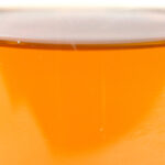 Close-up of the amber-colored ZERUST Axxanol 758 product.