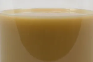 ZERUST Axxanol Spray-G liquid showing sprayable viscosity for effective corrosion prevention in mining operations.