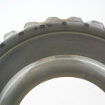 Close-up of a transmission part coated with long-term rust preventative oil.