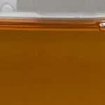 Amber-colored ZERUST Axxanol A35CD-42 liquid in close-up view.