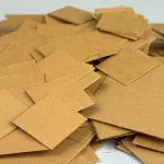 1-inch and 2-inch VCI Chips scattered for use in packaging and storage.