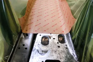 Interleaving metal parts with anti-corrosion paper for export