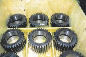 Gears packed securely with protective film inside a crate