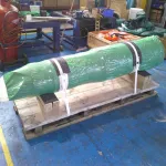 Large component packaged in ZERUST non-amine VCI film and strapped to wood pallet for storage and shipment.