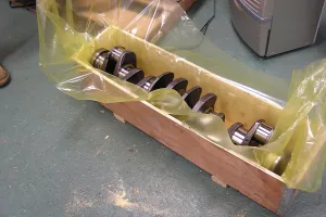 Crankshaft in wood crate lined with ZERUST VCI bag for corrosion protection