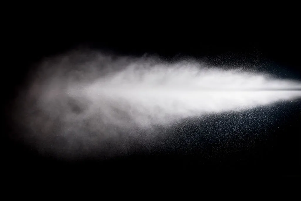Technician fogging ActivPowder into a ship void for corrosion prevention