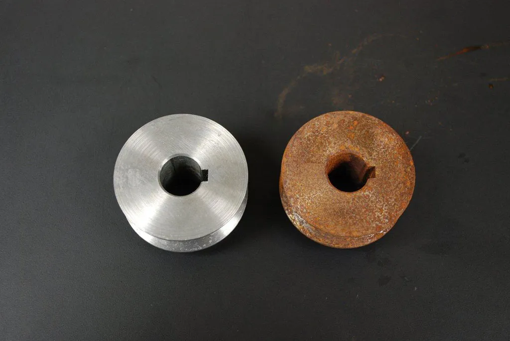 Before and after comparison of rusted metal component cleaned using Marine Corrosion Control Solutions with AxxaClean 3048