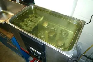 Industrial parts in ultrasonic parts washer cleaner using ZERUST AxxaWash solution