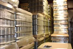 Pallets of parts wrapped in Zerust VCI packaging for corrosion protection in logistics