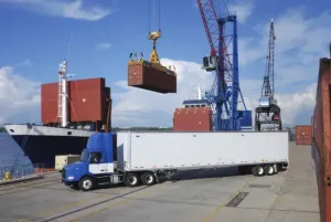 Shipping container loading operation demonstrating corrosion protection in logistics